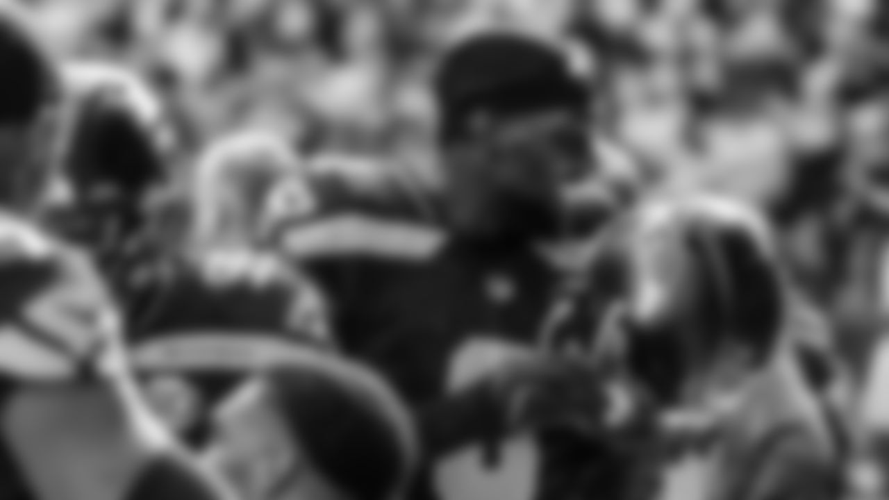 Seahawks linebacker Tyrice Knight (48) sacks Cardinals QB Jacoby Brissett and defensive end DeMarcus Lawrence (0) scoops the ball up and scores the touchdown.