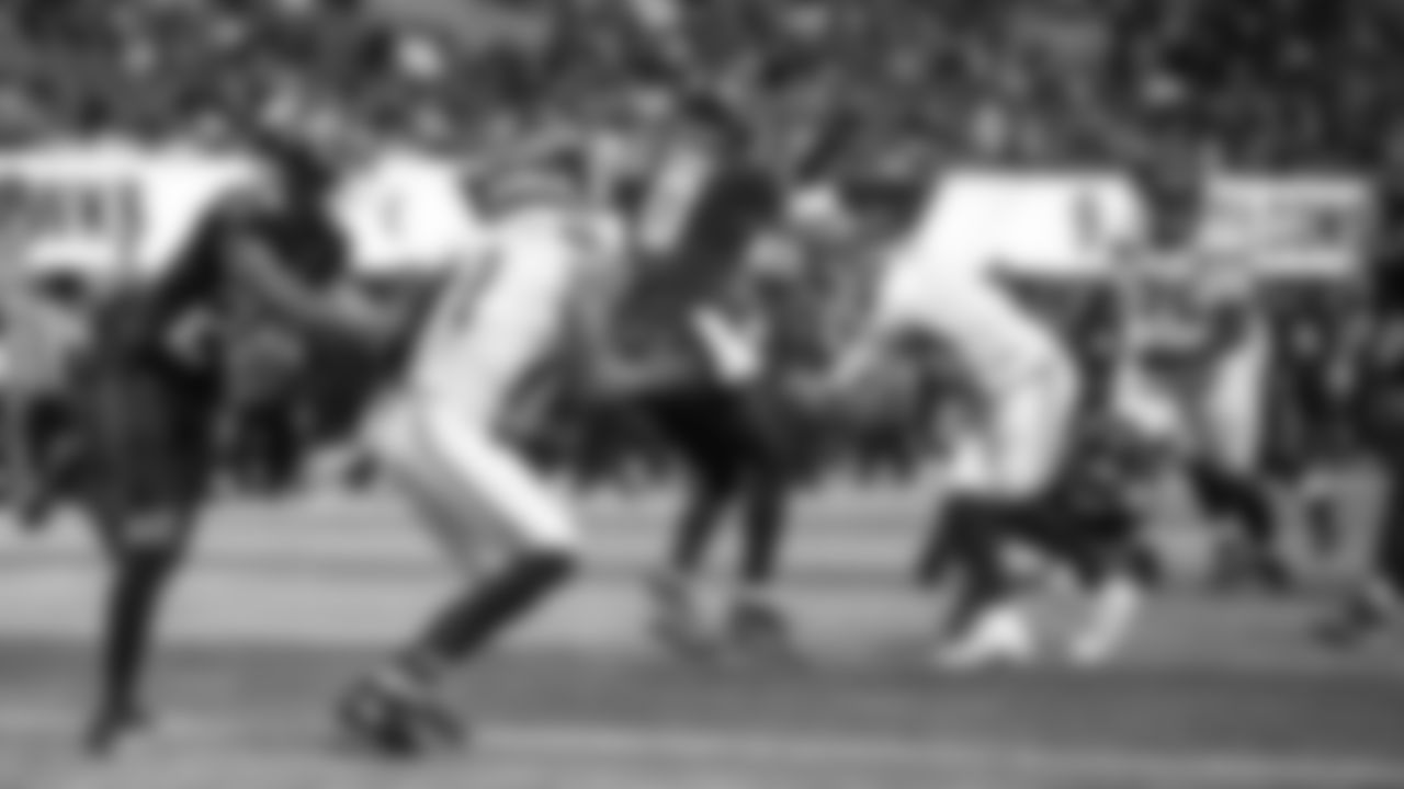 Seahawks quarterback Sam Darnold somehow threw this pass underneath the arms of an onrushing Falcons defender into the hands of waiting receiver Jaxon Smith-Njigba for a touchdown in the fourth quarter.