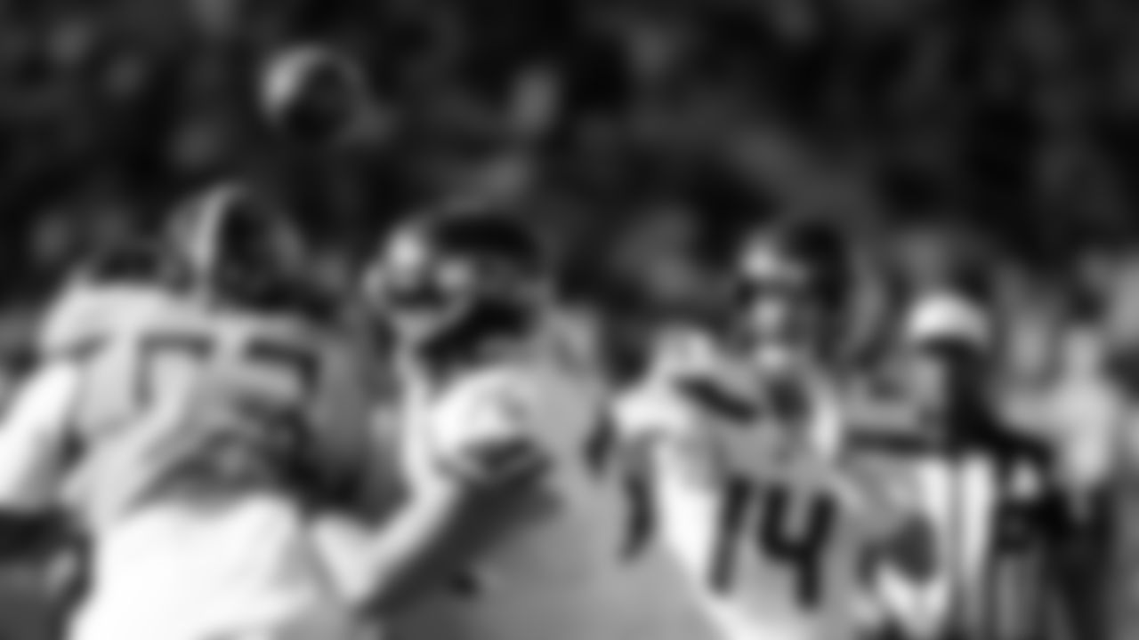 Seahawks quarterback Sam Darnold rifles a pass downfield.