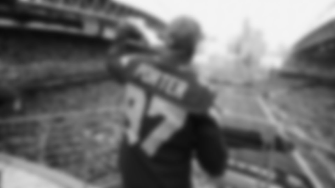 Seahawks Legends Rufus Porter and John L. Williams raise 12 flag in week 15 on December 14, 2025