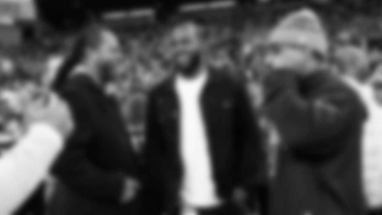 Seahawks Legends Richard Sherman and Kam Chancellor talk with safety Quandre Diggs on the sidelines before the game.