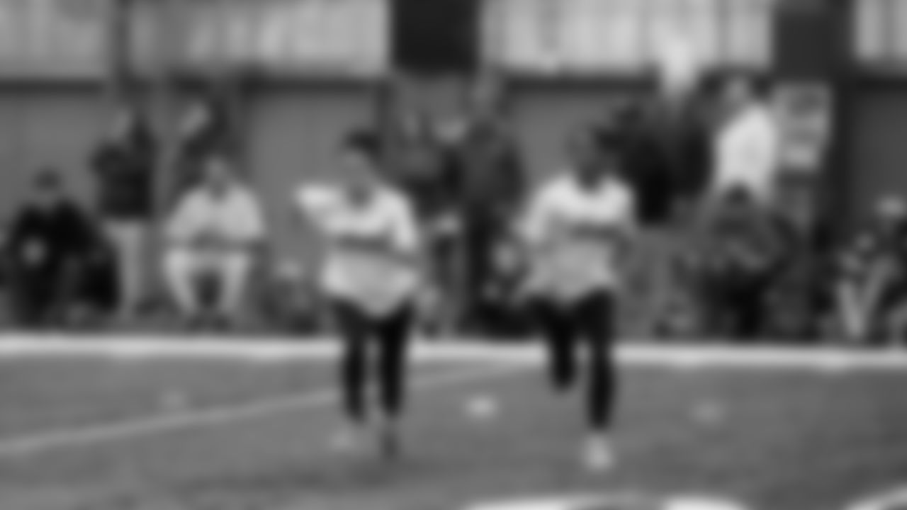 The Seahawks Women's Association packed girls flag kits and hosted a free girls flag football camp at the Seahawks training facility on Saturday, November 8, 2025.