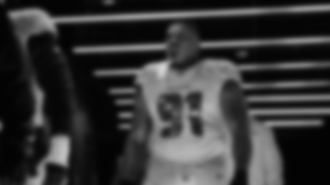 Seahawks defensive tackle Byron Murphy II (91) walks through the Emerald Queen Casino tunnel club at Lumen Field for the Week 16 matchup vs. Rams.