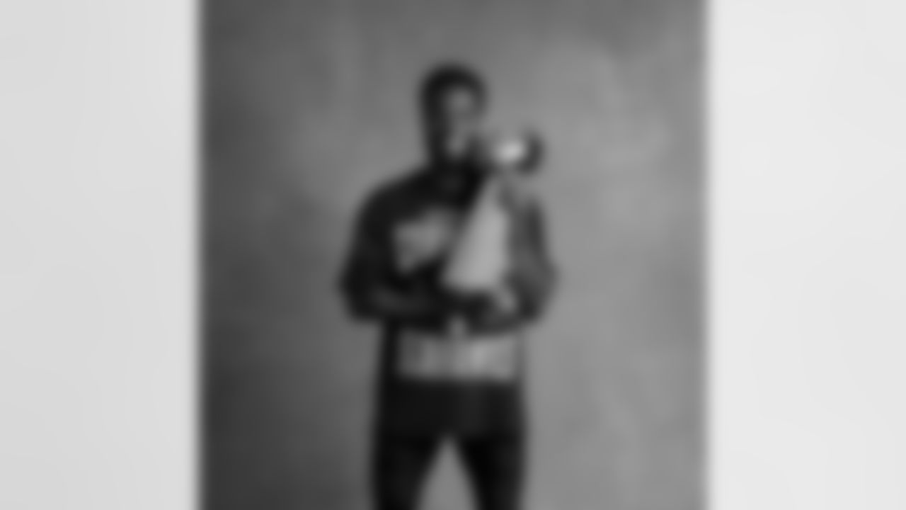 Seahawks cornerback Devon Witherspoon (21) with the Lombardi Trophy after winning Super Bowl LX.