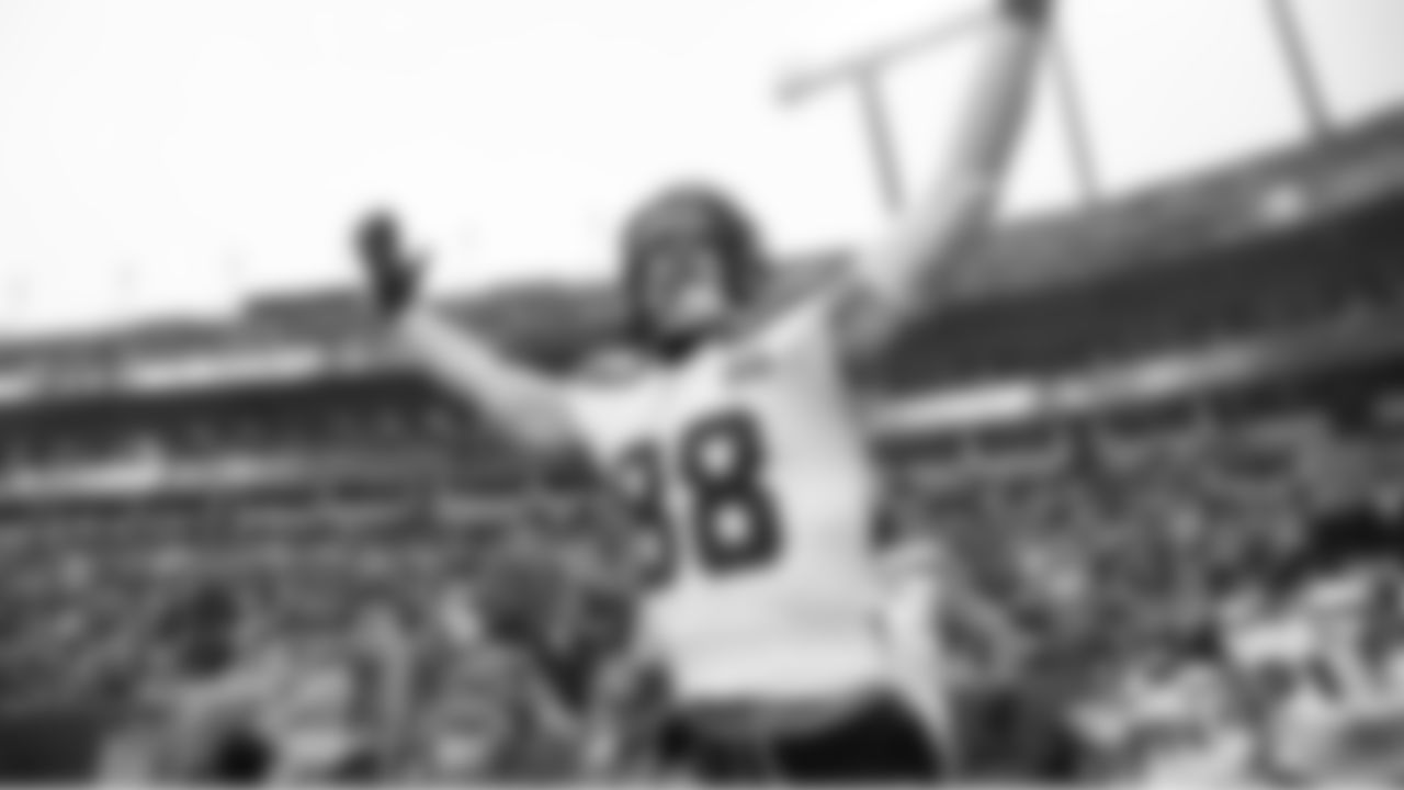 Seahawks tight end AJ Barner and the team enters the field.