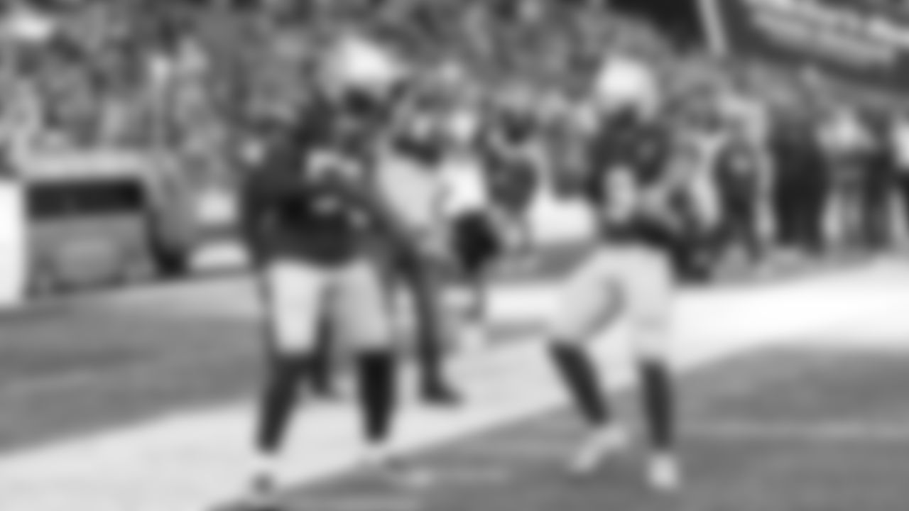 Seahawks Boye Mafe and Kenneth Walker III get loose to the music during pregame.