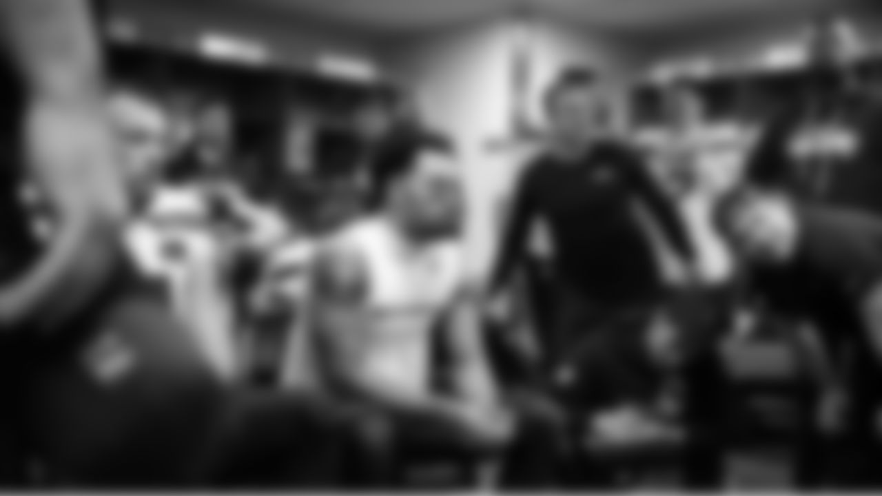 During halftime, Jaxon Smith-Njigba and members of the offense listen to instructions.