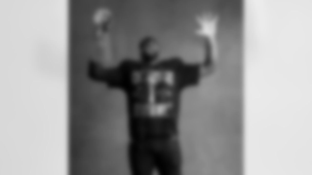 Seahawks defensive end Leonard Williams (99) with the Lombardi Trophy after winning Super Bowl LX.