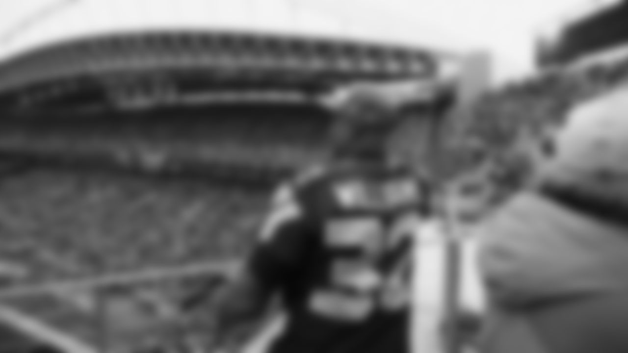 Seahawks Legends Rufus Porter and John L. Williams raise 12 flag in week 15 on December 14, 2025