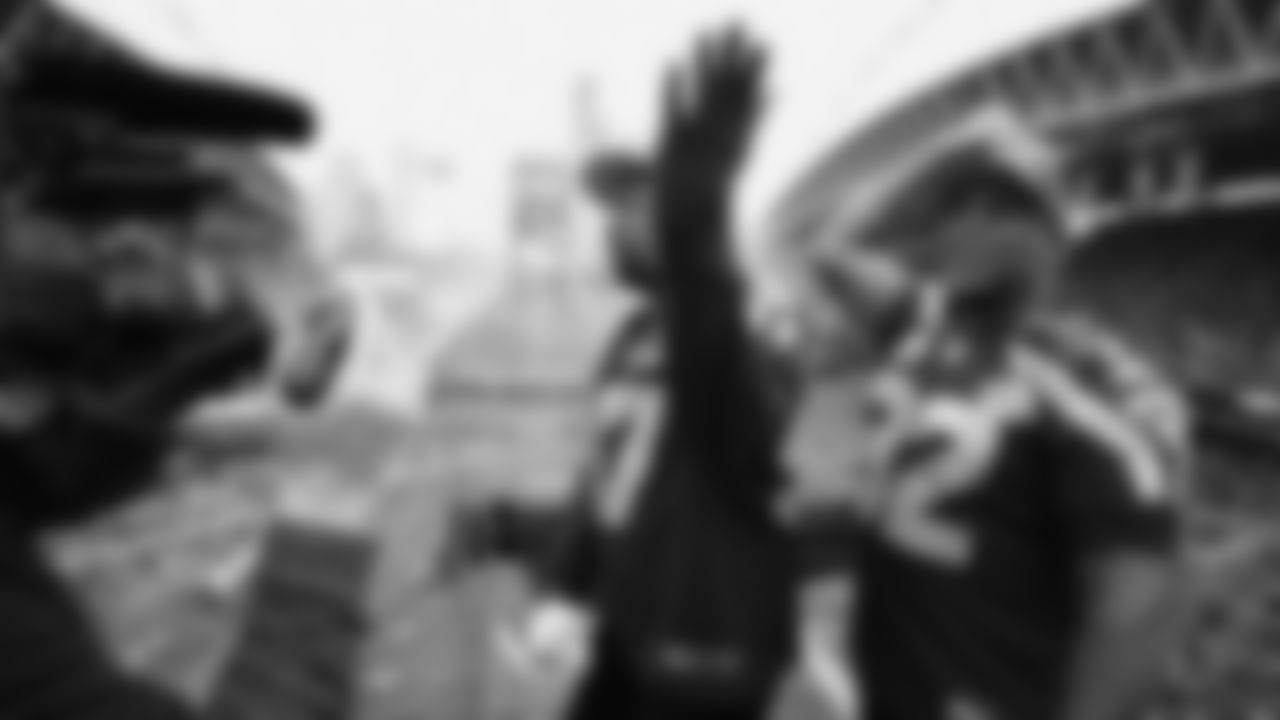 Seahawks Legends Rufus Porter and John L. Williams raise 12 flag in week 15 on December 14, 2025