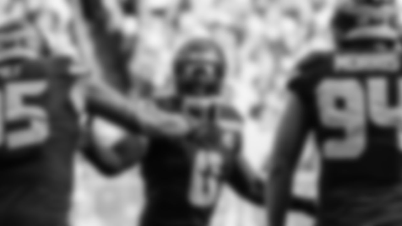 Seahawks linebacker Tyrice Knight (48) sacks Cardinals QB Jacoby Brissett and defensive end DeMarcus Lawrence (0) scoops the ball up and scores the touchdown.