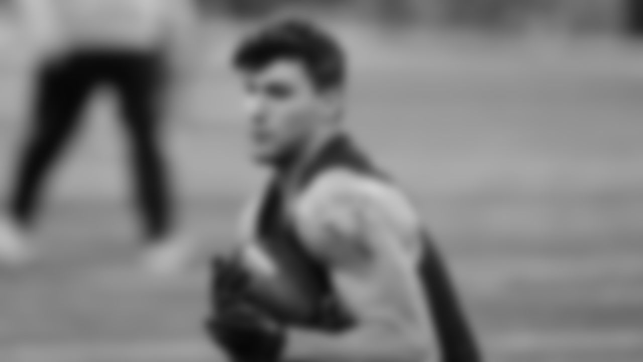 Michigan tight end AJ Barner runs a drill at the NFL football scouting combine, Friday, March 1, 2024, in Indianapolis. (AP Photo/Darron Cummings)