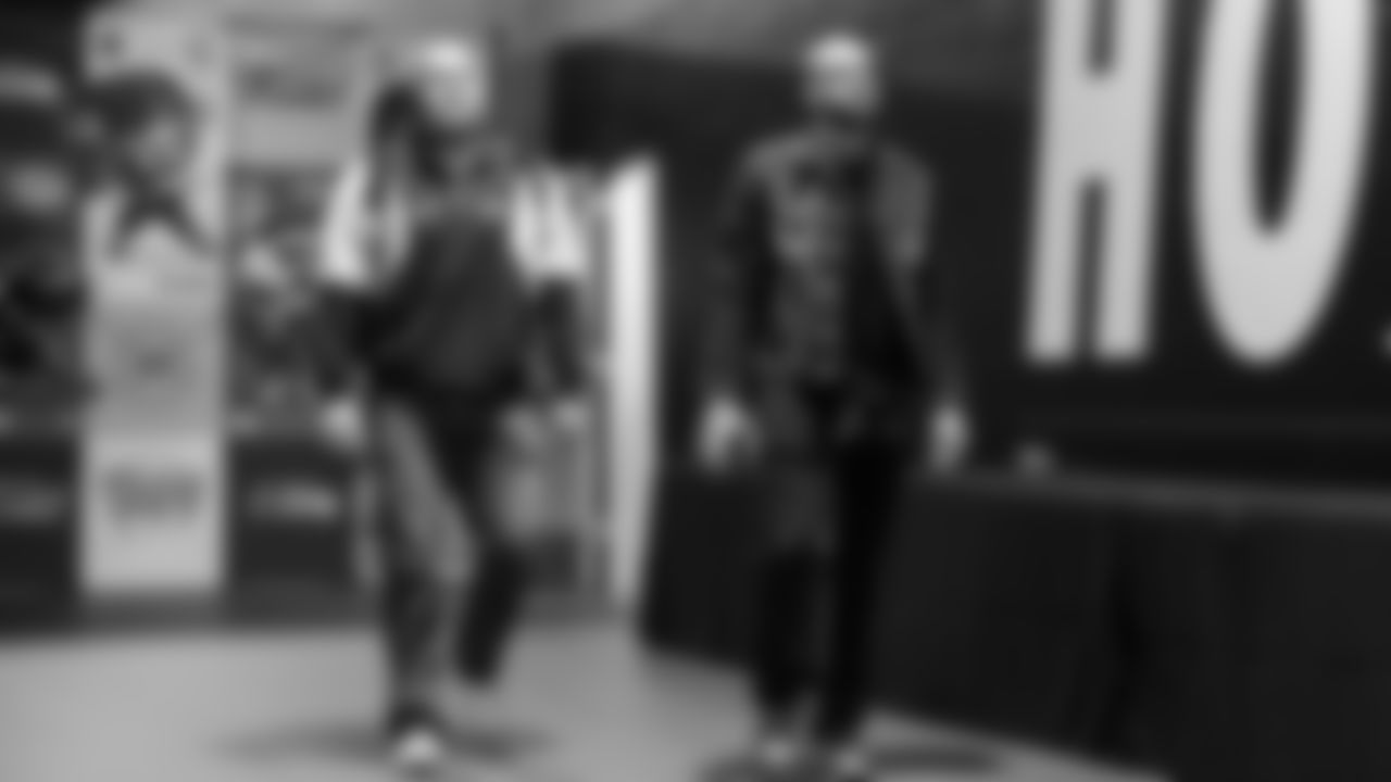 Seahawks guard Bryce Cabeldue (77) and wide receiver Cody White (82) arrive at Lumen Field for the Week 10 matchup vs. the Arizona Cardinals.