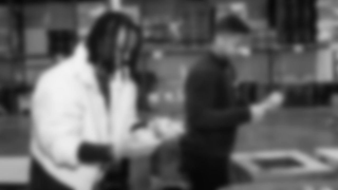 Seahawks Legend Bryan Walters, Dancers, Blitz and volunteers helped sort 4,800 pounds of action green apples at the Food Lifeline distribution center on January 22, 2026.