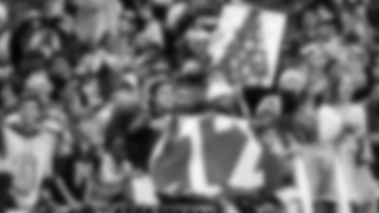 A throng of 12s salutes the Seahawks after the game as the players made their way to the locker room.