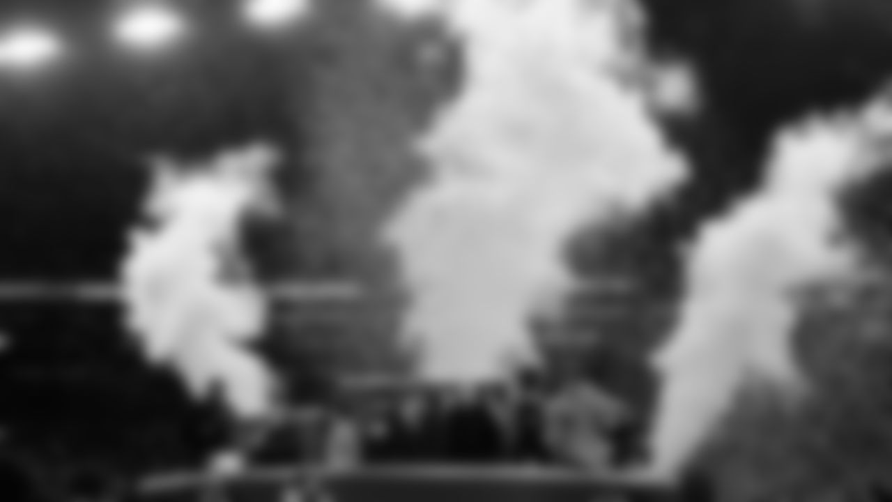 Michael Strahan, left, talks with Seattle Seahawks Chair Jody Allen, second from left, after the NFC Championship NFL football game against the Los Angeles Rams, Sunday, Jan. 25, 2026, in Seattle. (AP Photo/Godofredo A. Vásquez)