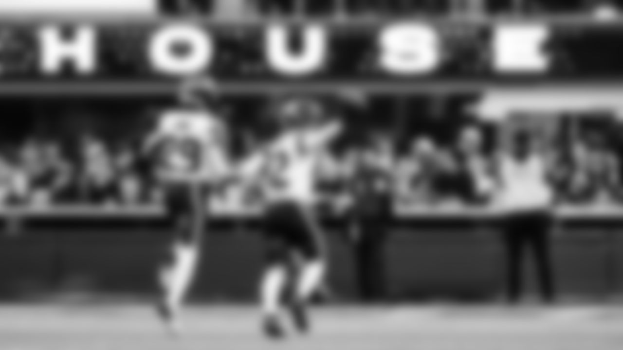 Seattle's Drake Thomas and Josh Jobe celebrate a fumble recovery by Thomas in the third quarter.