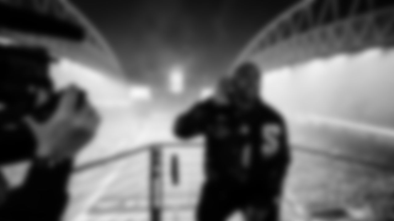 Seahawks Legend Doug Baldwin raising the flag in the 2025 Divisional Round on January 17, 2025.