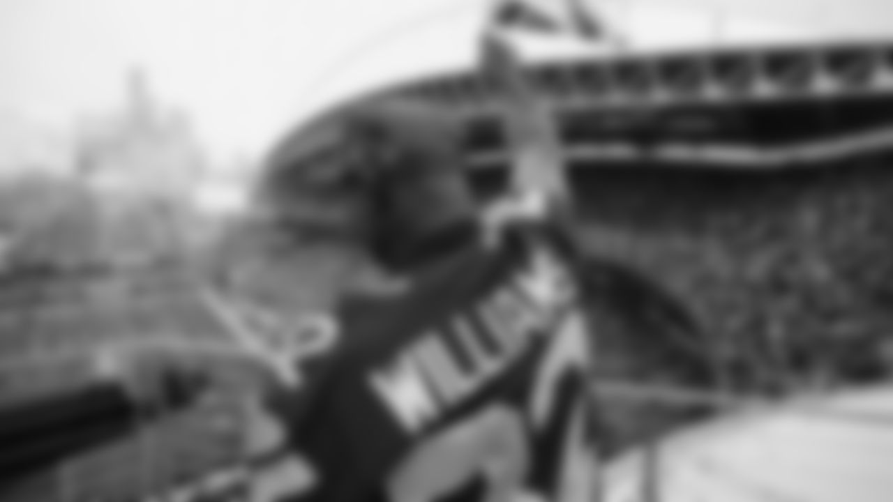 Seahawks Legends Rufus Porter and John L. Williams raise 12 flag in week 15 on December 14, 2025