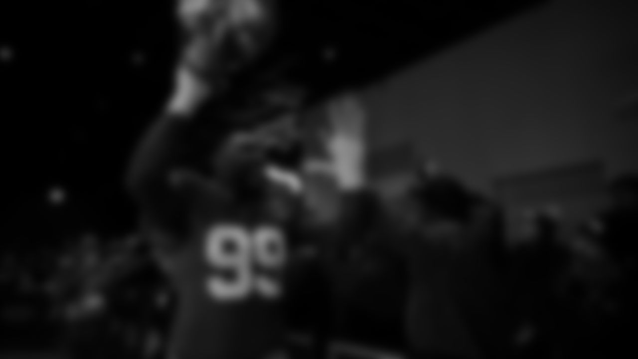 Seahawks defensive end Leonard Williams (99) walks through the Emerald Queen Casino tunnel club at Lumen Field for the Week 13 matchup vs. the Vikings.