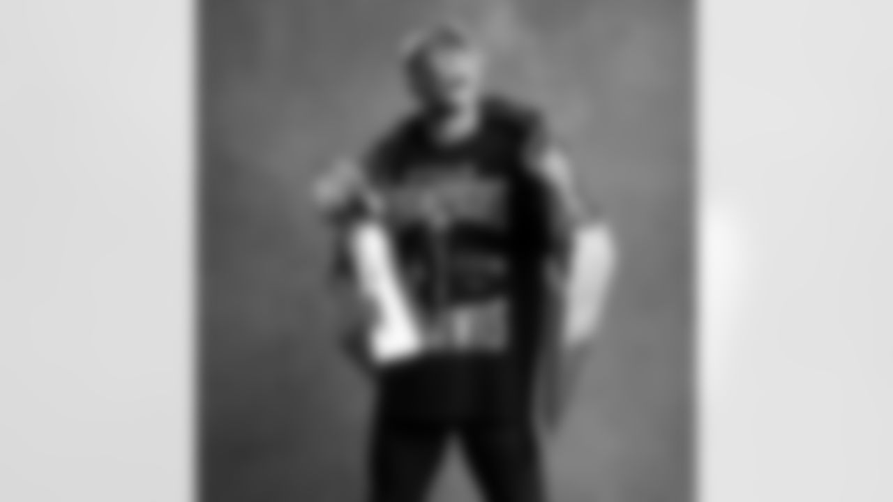 Seahawks wide receiver Jaxon Smith-Njigba (11) with the Lombardi Trophy after winning Super Bowl LX.