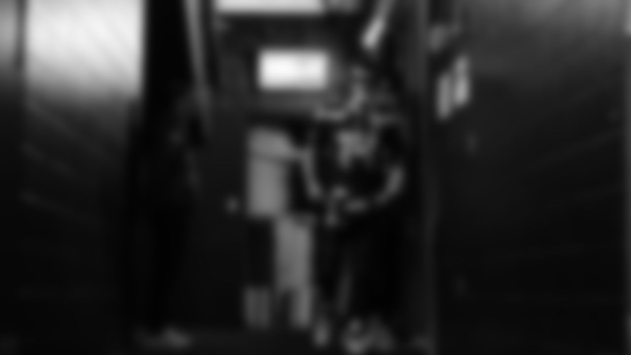 Seahawks quarterback Sam Darnold (14) walks through the Emerald Queen Casino tunnel club at Lumen Field for the Week 10 matchup vs. the Cardinals.