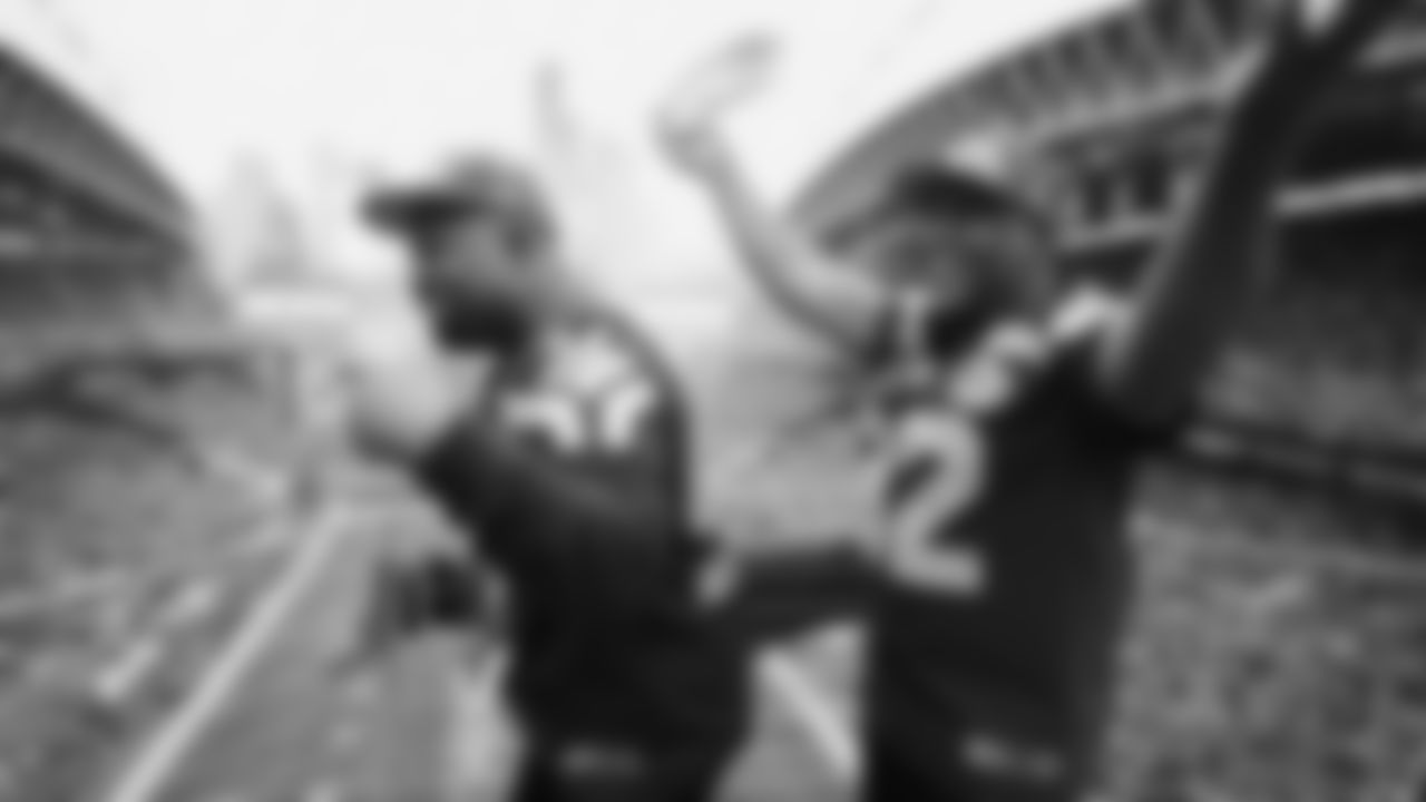 Seahawks Legends Rufus Porter and John L. Williams raise 12 flag in week 15 on December 14, 2025