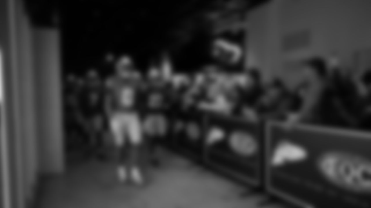 Seahawks defensive end DeMarcus Lawrence (0) walks through the Emerald Queen Casino tunnel club at Lumen Field for the Week 13 matchup vs. the Vikings.