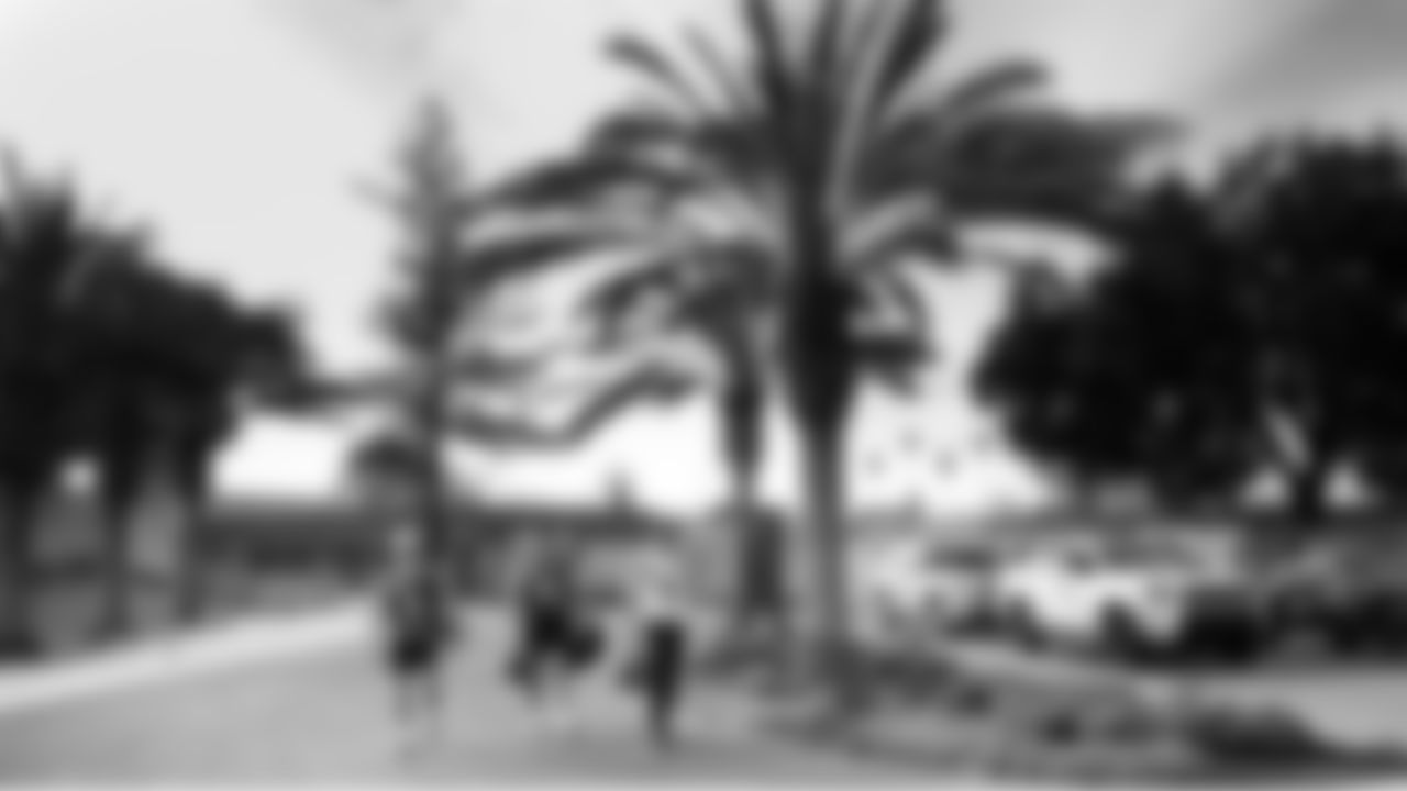 Seahawks specialists Jason Myers, Michael Dickson and Chris Stoll walk underneath the palms as they head from the practice field to the locker room.