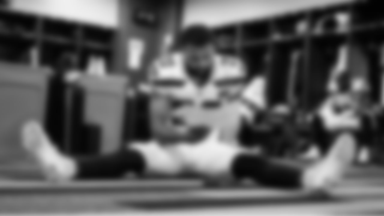 Seahawks safety Julian Love prepared for his return to action and studied his play sheet in the locker room before the game.