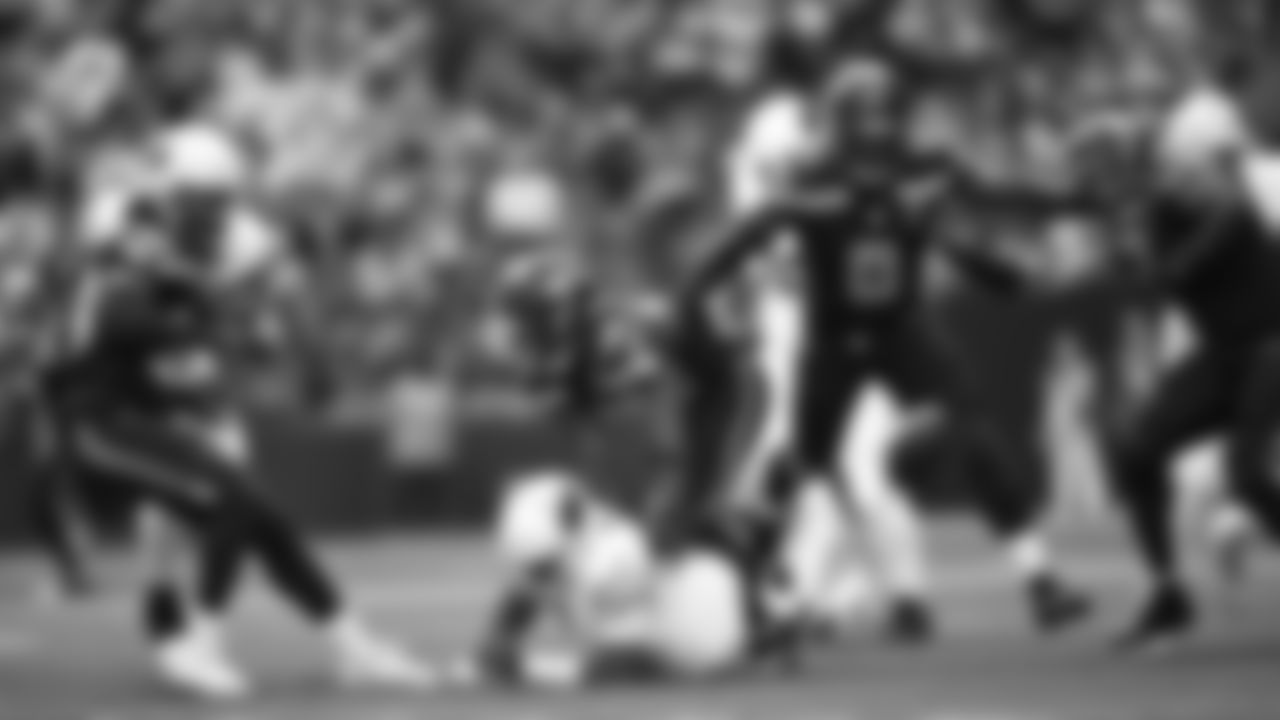 Seahawks linebacker Tyrice Knight (48) sacks Cardinals QB Jacoby Brissett and defensive end DeMarcus Lawrence (0) scoops the ball up and scores the touchdown.