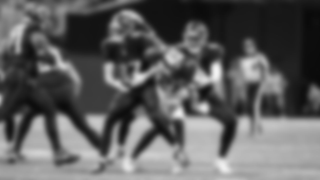 Seahawks cornerback Devon Witherspoon breaks up a pass intended for Atlanta's David Sills V that Witherspoon would ultimately intercept.