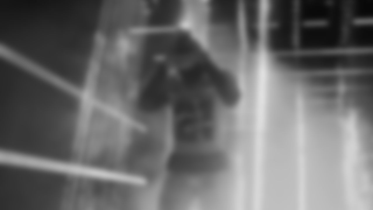 Seahawks cornerback Devon Witherspoon (21) walks through the Emerald Queen Casino tunnel club at Lumen Field for the Week 16 matchup vs. Rams.