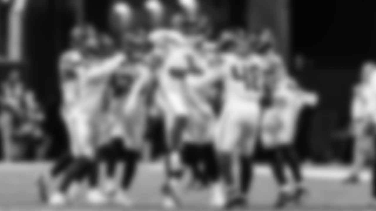 Seahawks special teamers celebrate with Nick Emmanwori after his blocked field goal.