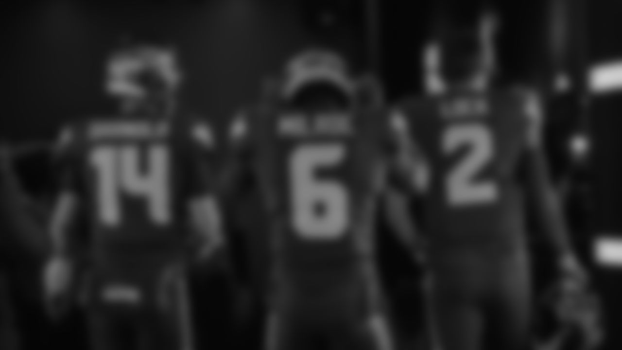 Seahawks quarterback Sam Darnold (14), quarterback Jalen Milroe (6) and quarterback Drew Lock (2) walk through the Emerald Queen Casino tunnel club at Lumen Field for the Week 3 matchup vs. the Saints on September 21, 2025.