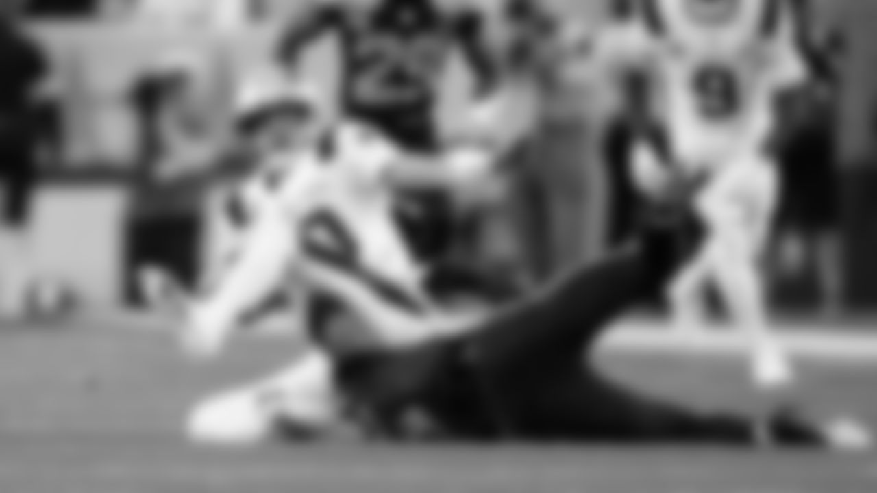 Patriots quarterback Drake Maye is dragged down by the Seahawks' Nick Emmanwori.