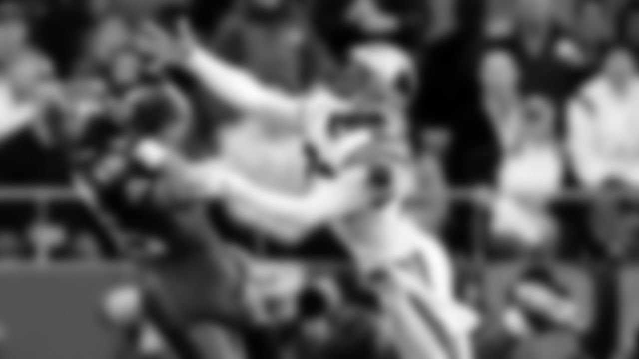 Seattle Seahawks' Seneca Wallace, left, makes an over-the-shoulder reception as Carolina Panthers' Ken Lucas defends in the NFC championship football game in this Jan. 22, 2006 file photo in Seattle.  (AP Photo/Elaine Thompson, File)