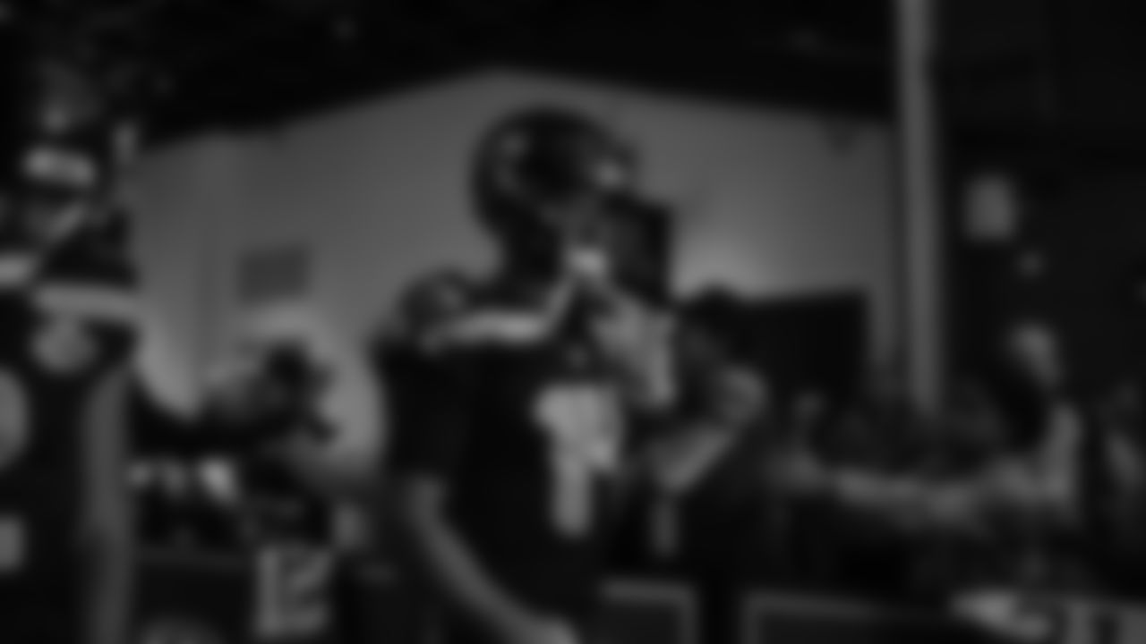 Seahawks quarterback Sam Darnold (14) walks through the Emerald Queen Casino tunnel club at Lumen Field for the Week 10 matchup vs. the Cardinals.