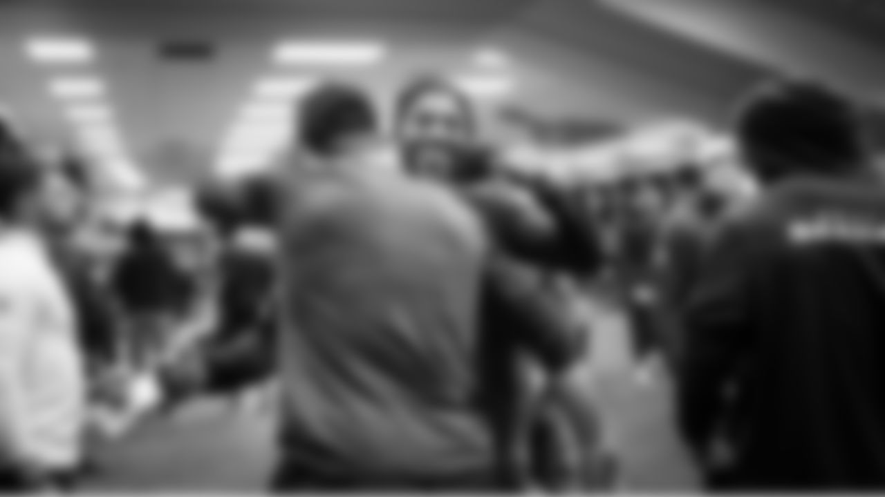 Cornerback Josh Jobe greets teammates in the locker room.