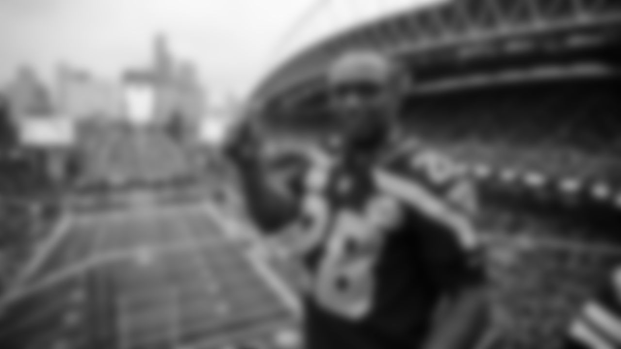 Seahawks Legend Curt Warner raises the 12 Flag before the 2nd preseason game against the Chiefs on August 15th.