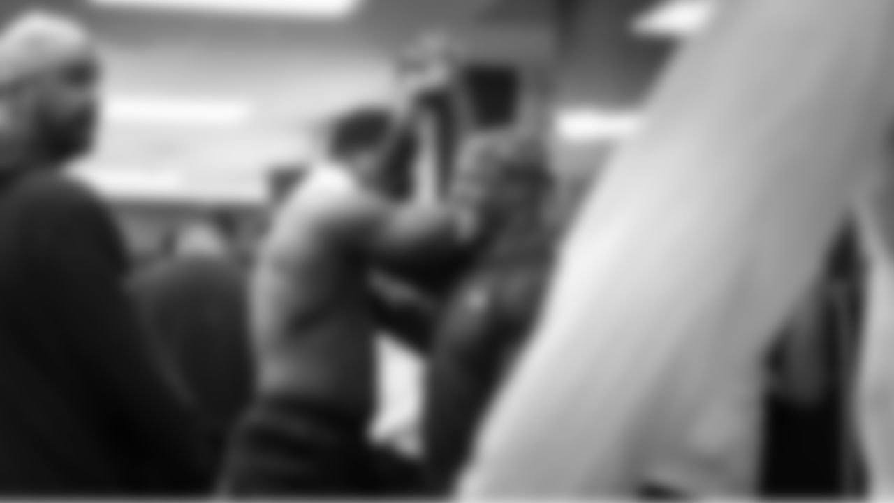 Seahawks Derick Hall and Kenneth Walker III keep things light in the locker room before practice.