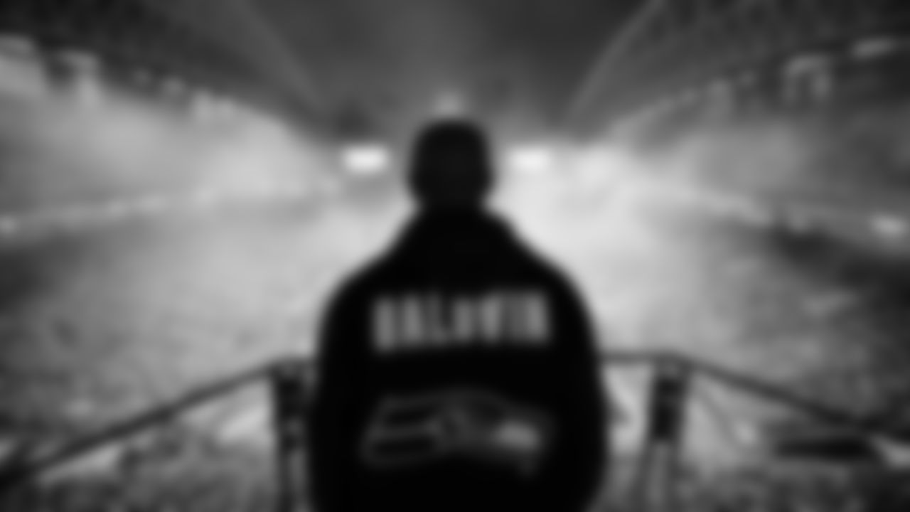 Seahawks Legend Doug Baldwin raising the flag in the 2025 Divisional Round on January 17, 2025.