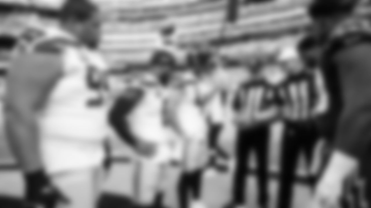 Captains Al Woods, Quandre Diggs and Nick Bellore meeting with officials and the Cardinals captains for the coin toss.