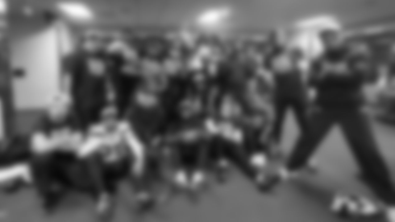 Seahawks defensive backs pose for a group photo in the locker room after clinching the NFC West title.