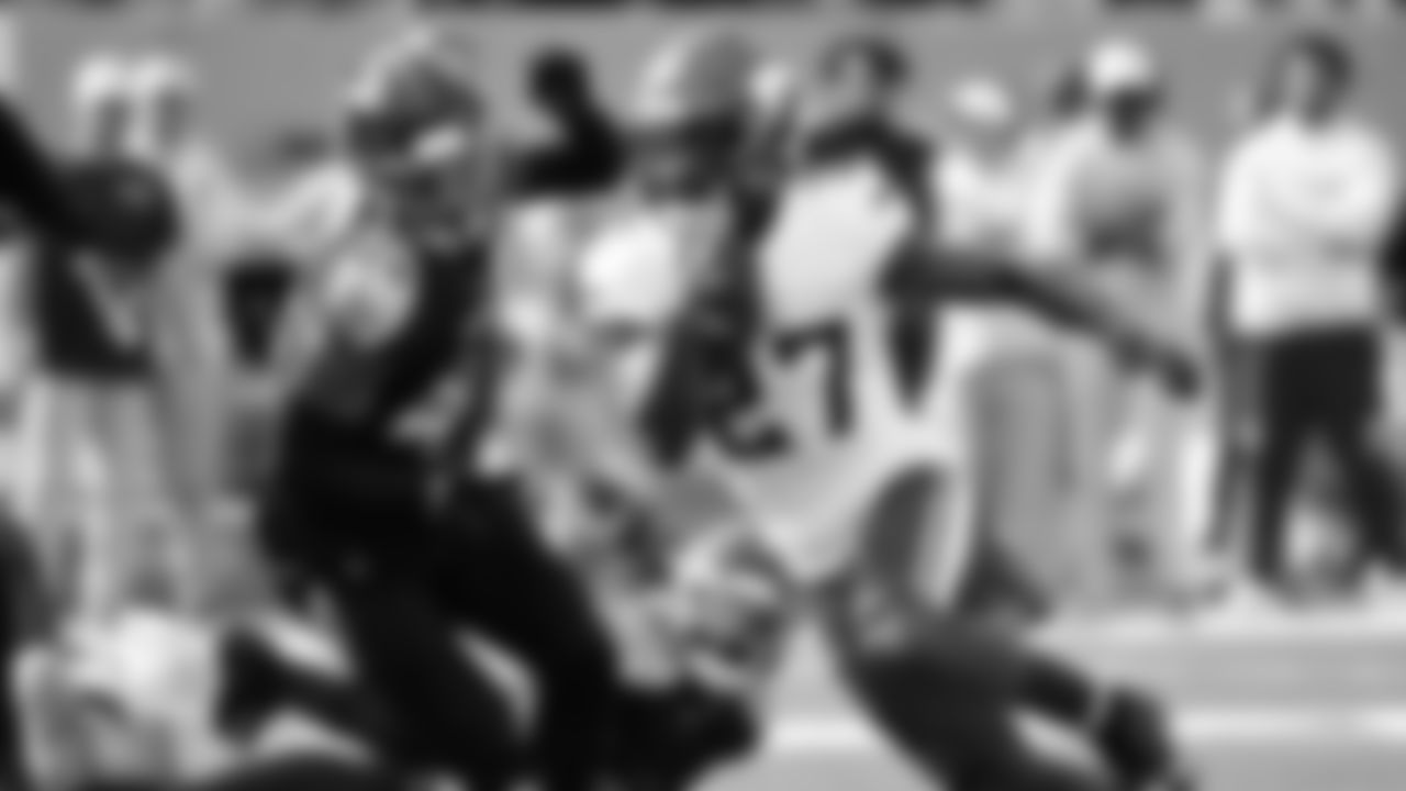 Minnesota Vikings running back Cam Akers (27) runs from Tennessee Titans safety Mike Brown (44) during the first half of an NFL football game, Sunday, Nov. 17, 2024, in Nashville, Tenn. (AP Photo/John Amis)