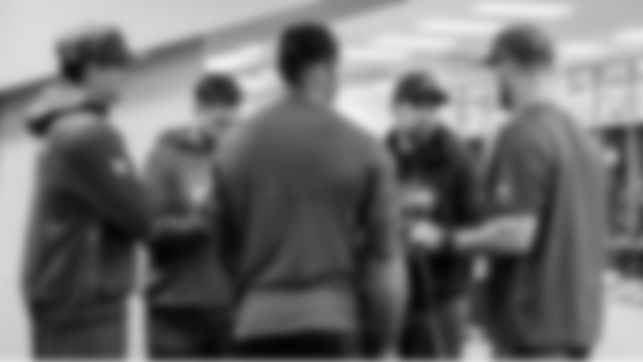 Seahawks quarterbacks coach Andrew Janocko and offensive coordinator Klint Kubiak meet with quarterbacks Drew Lock, Jalen Milroe and Sam Darnold in the locker room before the game.