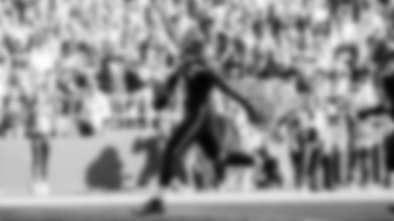 Seahawks linebacker Tyrice Knight (48) sacks Cardinals QB Jacoby Brissett and defensive end DeMarcus Lawrence (0) scoops the ball up and scores the touchdown.