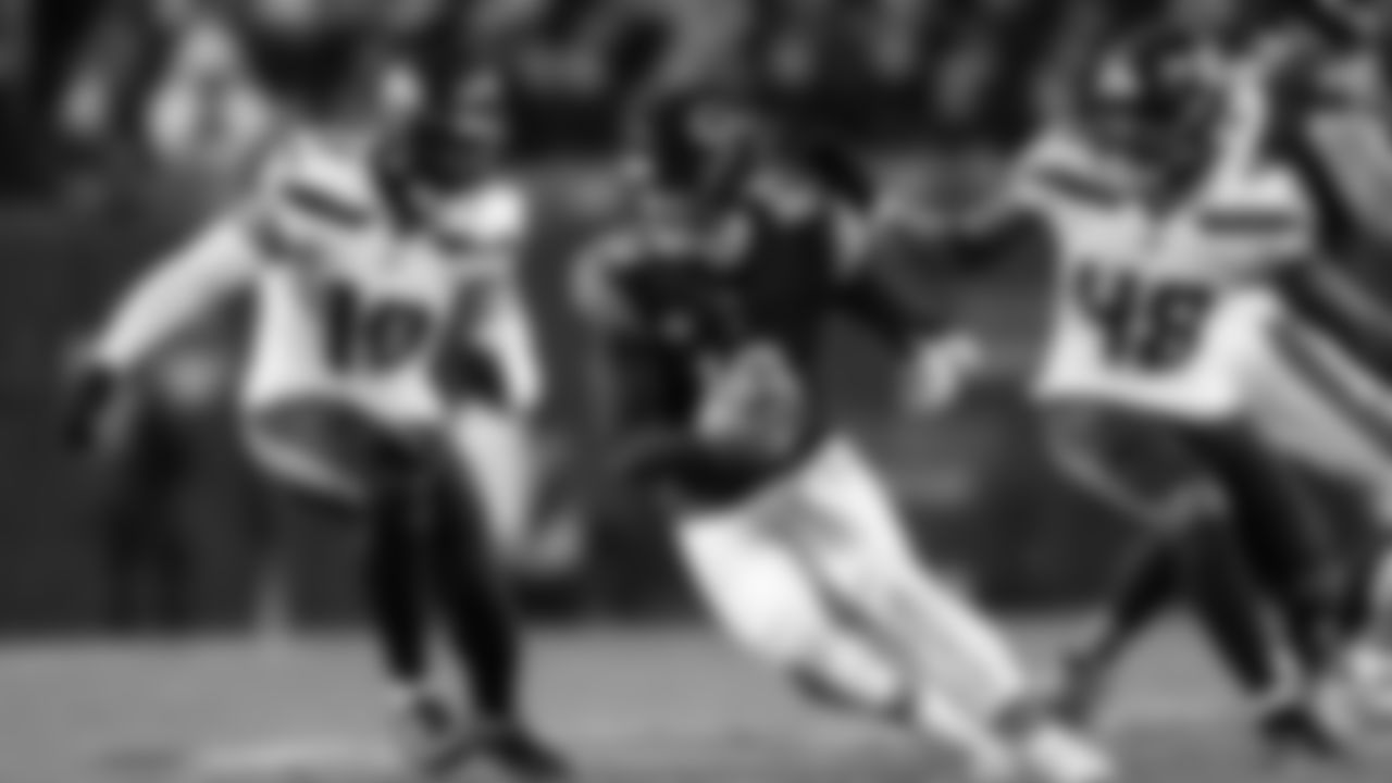 Seahawks Uchenna Nwosu and Tyrice Knight pressure Bears quarterback Caleb Williams on this play that ended with a sack by Nwosu.