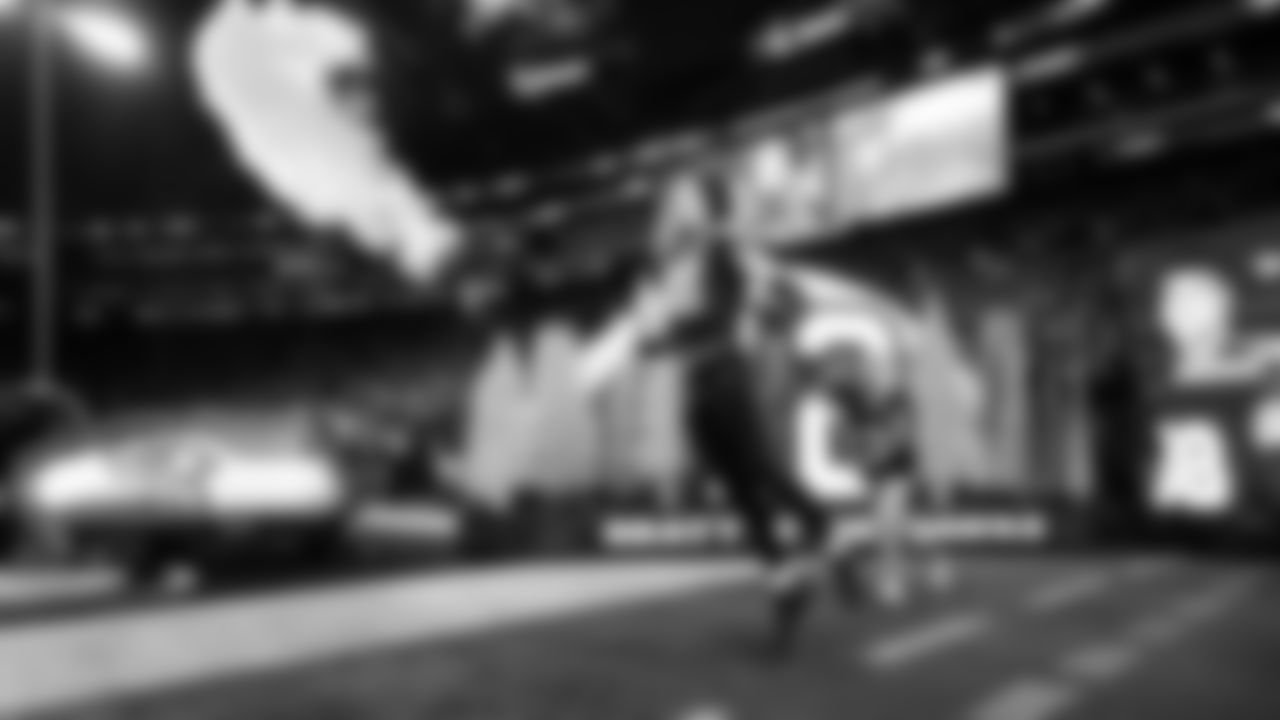 Seahawks tight end AJ Barner lets out a yell as he is introduced.