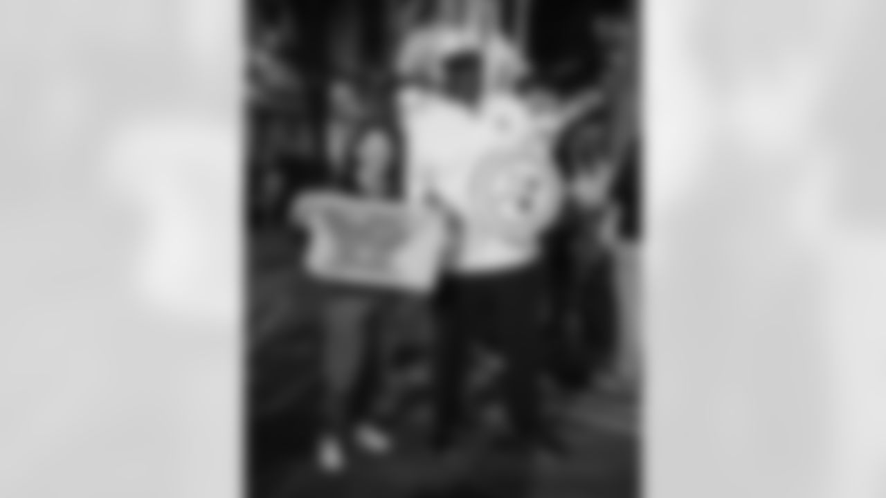 Pittsburgh Steelers legend Max Starks gives out Terrible Towels to locals on Tuesday, Sept. 23, 2025 in Galway, Ireland. (Brendan Moran / Pittsburgh Steelers)